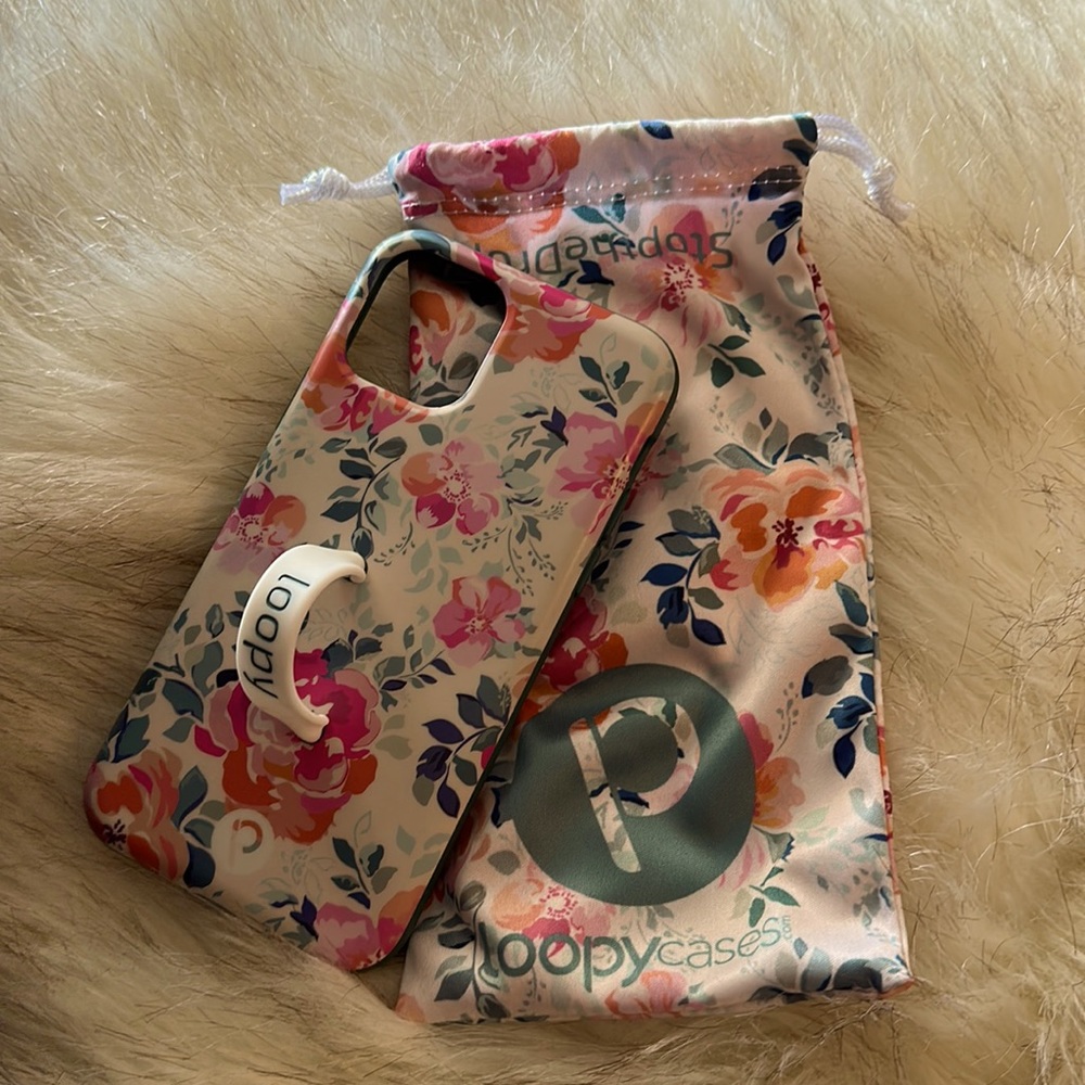 Loopy 11 pro righty case with loop and bag. Gardenia with teal bumper.